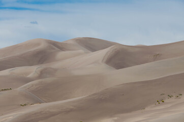 Great Sand Dunes National Park, Colorado, USA. Beautiful scenic majestic sand dunes and mountain peaks. Travel destination location for camping, hiking, relaxing and enjoying natures beauty.