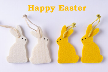 Figures of Easter bunnies on a white background.