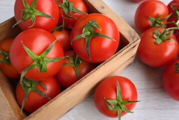 tomatoes in a wooden bowl