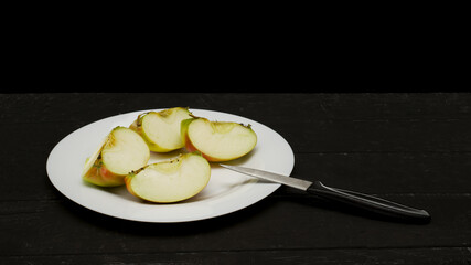 Cut Apple on a black background on a Table
