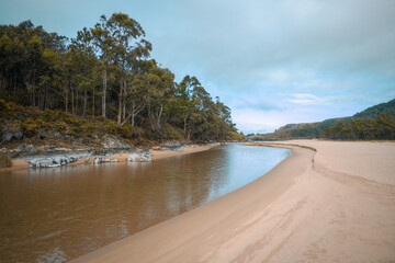 Freshwater channel runs through a beach