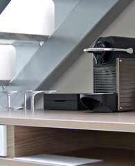Coffee espresso maker and mini bar selection amenities inside suite stateroom cabin onboard modern...