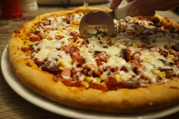 homemade mixed pizza and ps4 and drink