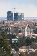 Fototapeta premium A view to three high office building with crane between at Brno, Czech republic
