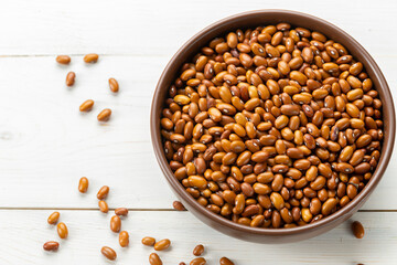 Dried red beans in a clay bowl