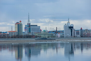 Fototapeta premium View of the city of Heihe, China from the city of Blagoveshchensk, Russia across the Amur river. Travel ban due to COVID-19.