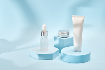 Three cosmetic product mockups on geometric podiums. Background for presentation of cosmetic