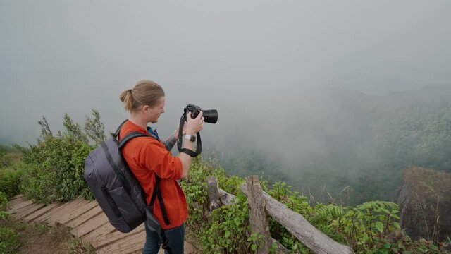 Man photographer making photo at Kew mae pan nature trail at Doi Inthanon national park ,Chiangmai