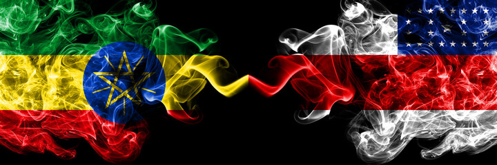 Ethiopia, Ethiopian vs Brazil, Brazilian, Amazonas smoky mystic flags placed side by side. Thick colored silky abstract smoke flags.