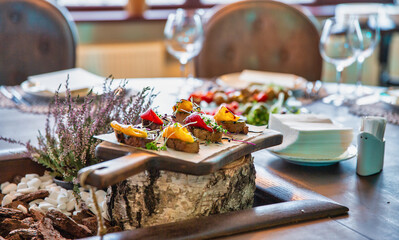 bruschetta with baked pepper and microgreens are served in restaurant