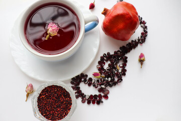 pomegranate tea in a teacup and oriental sweets