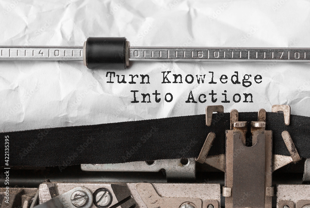 Poster text turn knowledge into action typed on retro typewriter
