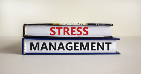 Stress management symbol. Books with words 'Stress management'. Beautiful white background. Psychological, business and stress management concept. Copy space.