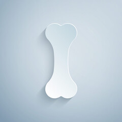 Paper cut Dog bone icon isolated on grey background. Pets food symbol. Paper art style. Vector