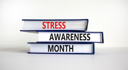 Stress awareness month symbol. Books with words 'Stress awareness month'. Beautiful white background. Psychological, business and stress awareness month concept. Copy space.