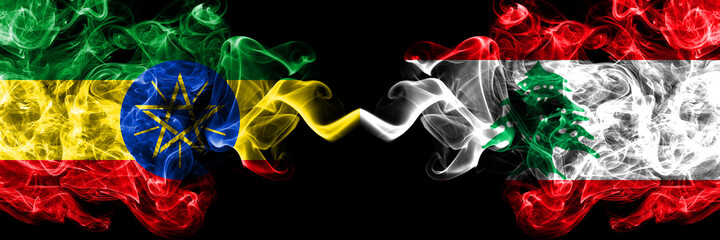 Ethiopia, Ethiopian vs Lebanon, Lebanese smoky mystic flags placed side by side. Thick colored silky abstract smoke flags.