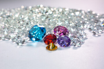 colorful diamonds are placed on a pile of white diamonds And keep turning. video 4k resolution shoot in studio.