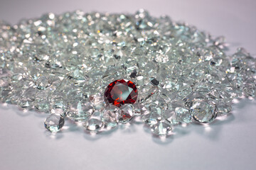 Red ruby diamonds are placed on a pile of white diamonds And keep turning. video 4k resolution shoot in studio..