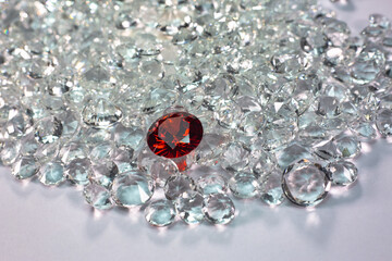 Red ruby diamonds are placed on a pile of white diamonds And keep turning. video 4k resolution shoot in studio..