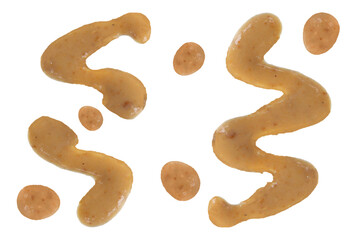 Splashes and spilled peanut sauce isolated on white background 
