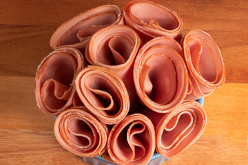 Portion of sliced mortadella on a bowl