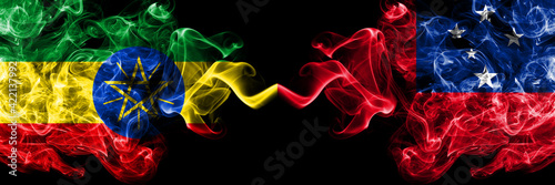 Ethiopia, Ethiopian vs Samoa smoky mystic flags placed side by side. Thick colored silky abstract smoke flags.
