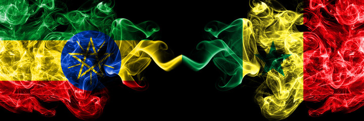 Ethiopia, Ethiopian vs Senegal smoky mystic flags placed side by side. Thick colored silky abstract smoke flags.