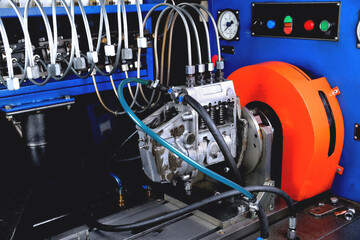 A fuel pump for a diesel engine after repair on an adjustment stand in a workshop, repair of a fuel...