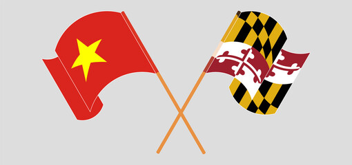 Crossed and waving flags of Vietnam and the State of Maryland
