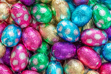 Fototapeta na wymiar Chocolate Candy eggs in colorful foil for Easter