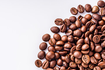 aromatic fresh coffee beans on a white acrylic background