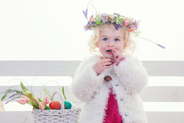 little girl with easter eggs