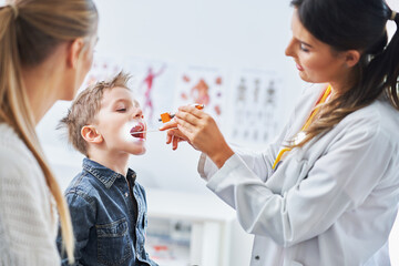 Little boy having medical examination by pediatrician