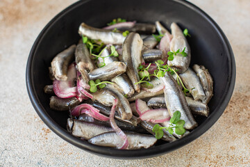 anchovy fish seafood marinated salad appetizer small herring healthy vegetarian pescetarian meal top view copy space food background rustic image