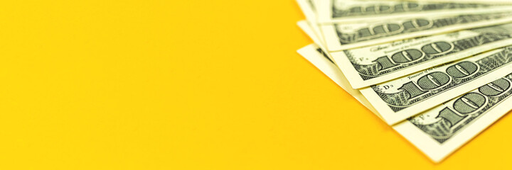A pile of US dollar bills backgrond, banner of office desk with money, copy space