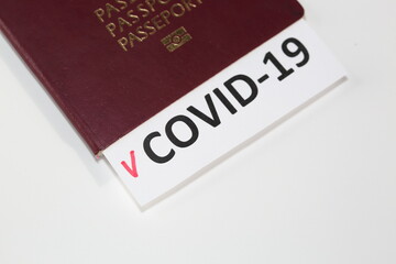 passport with page COVID-19 check list on a white background