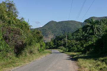 Fototapeta na wymiar Lonely road in the rural Escambray Mountains, Cienfuegos province, Cuba.