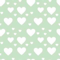 Colorful seamless pattern with hearth symbol and pastel green background