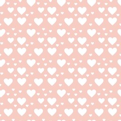 Colorful seamless pattern with hearth symbol and pastel peachy background