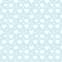 Colorful seamless pattern with hearth symbol and pastel blue background