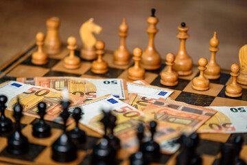 chess table with figures and real money
