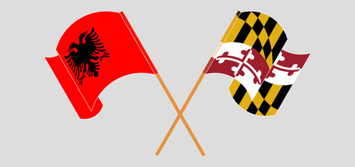 Crossed and waving flags of Albania and the State of Maryland