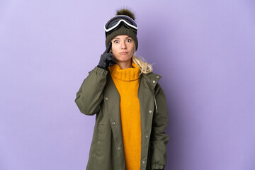 Skier Russian girl with snowboarding glasses isolated on purple background thinking an idea