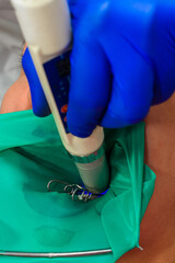 The dentist uses ultraviolet light when filling teeth, light blue.