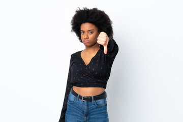 Young African American woman isolated on white background showing thumb down with negative expression