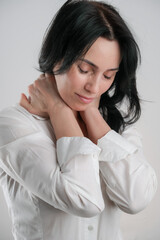 Portrait of beautiful mature brunette woman isolated on gray white background, copy space