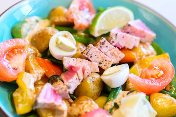 Close up image of fresh and tasty Nicoise salad with tuna fish