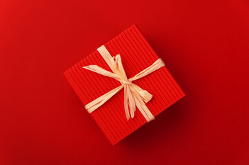 red gift box on red background 