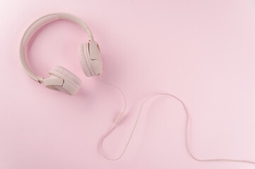 pink headphones on pink background 