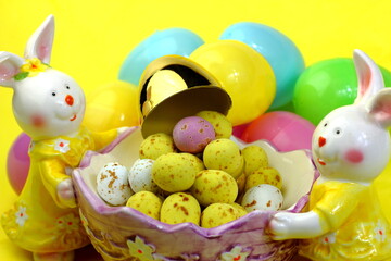 Easter Bunny with golden egg and Easter eggs